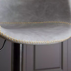 Tabouret de bar pivotant GDFStudio Grantha en similicuir, réglable en hauteur, avec repose-pieds