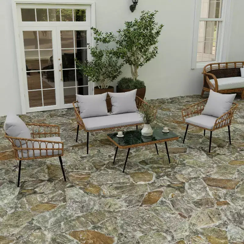 Merrick Lane Four Piece Indoor/Outdoor Boho Open Weave Natural Rattan Rope Patio Set with Two Chairs, Loveseat and Table with Cushions