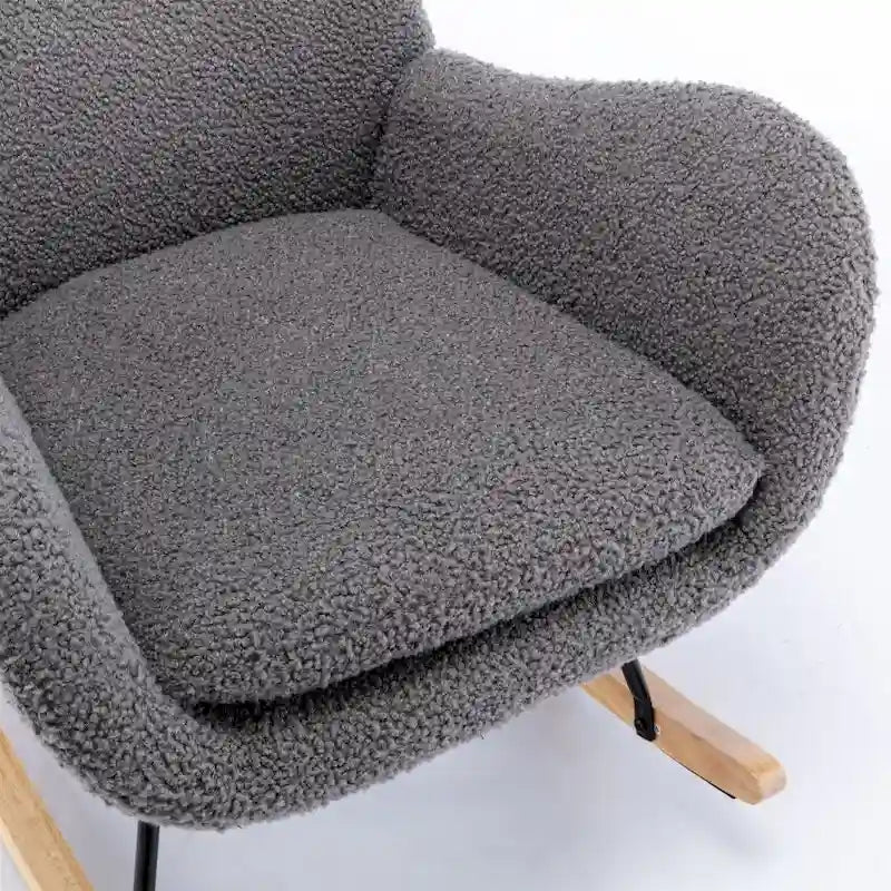 Fauteuil à bascule en tissu rembourré avec dossier haut et accoudoirs