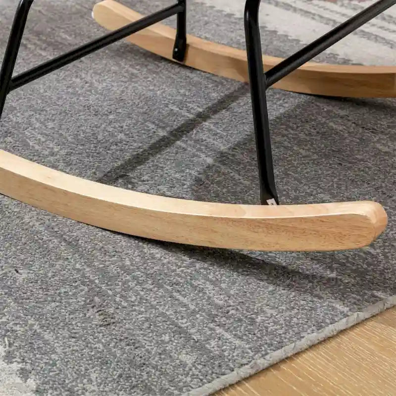 Fauteuil à bascule en tissu rembourré avec dossier haut et accoudoirs
