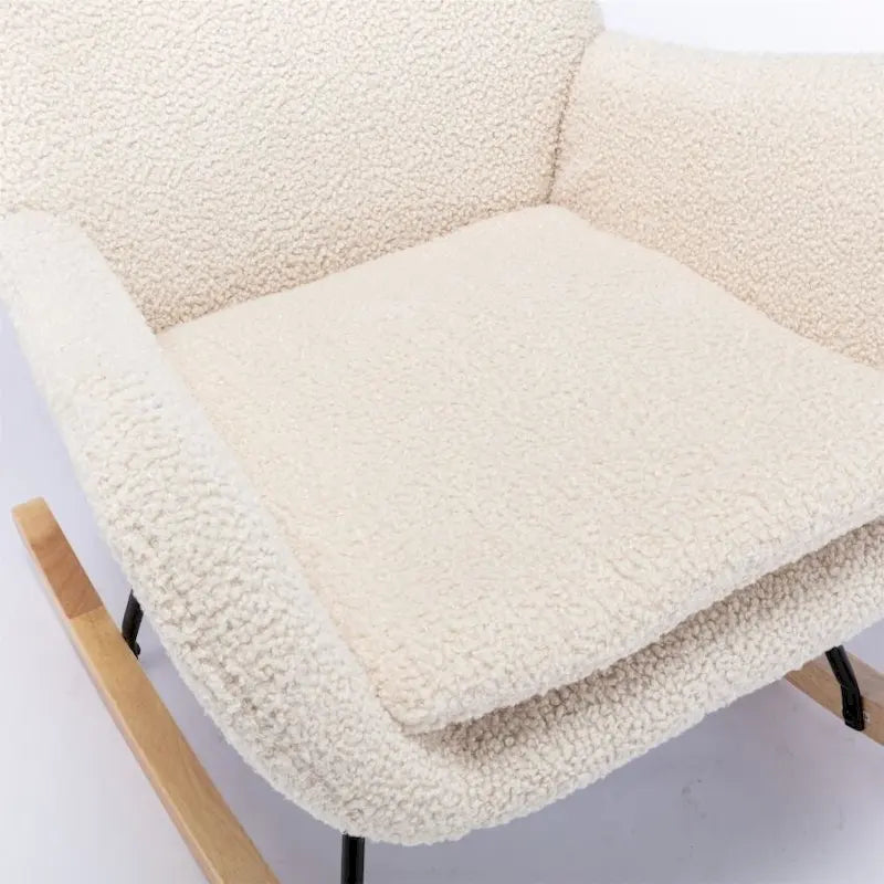 Fauteuil à bascule en tissu rembourré avec dossier haut et accoudoirs