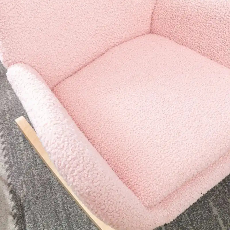 Fauteuil à bascule en tissu rembourré avec dossier haut et accoudoirs